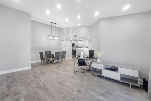 469 NE 207th Ln Unit 205, Miami, FL 33179 - home office with recessed lighting, baseboards, wood finished floors, and lofted ceiling