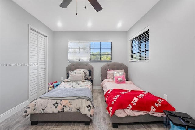 469 NE 207th Ln Unit 205, Miami, FL 33179 - bedroom with wood finished floors, baseboards, a closet, and a ceiling fan