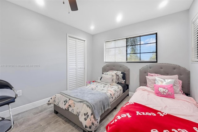 469 NE 207th Ln Unit 205, Miami, FL 33179 - bedroom with baseboards, wood finished floors, a ceiling fan, a closet, and recessed lighting