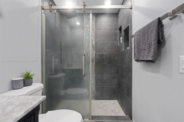 469 NE 207th Ln Unit 205, Miami, FL 33179 - bathroom with toilet, vanity, and a shower stall
