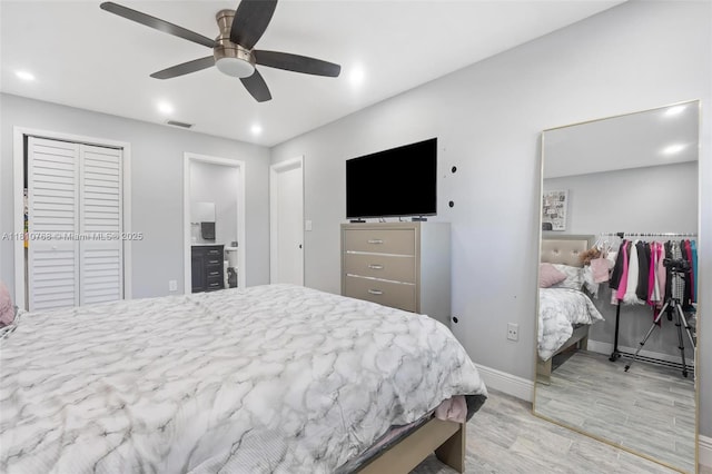 469 NE 207th Ln Unit 205, Miami, FL 33179 - bedroom with wood finished floors, baseboards, recessed lighting, a ceiling fan, and ensuite bath