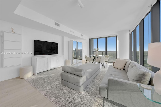 650 NE 32nd St Unit 3708, Miami, FL 33137 - living room featuring a wall of windows and wood finished floors