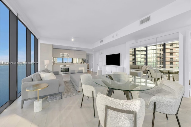 650 NE 32nd St Unit 3708, Miami, FL 33137 - dining room featuring a water view and plenty of natural light