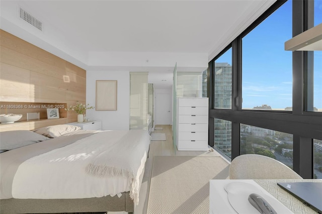 650 NE 32nd St Unit 3708, Miami, FL 33137 - bedroom with wood walls and expansive windows