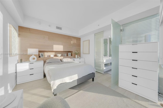 650 NE 32nd St Unit 3708, Miami, FL 33137 - bedroom featuring wooden walls and a tray ceiling