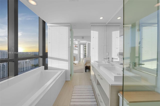 650 NE 32nd St Unit 3708, Miami, FL 33137 - ensuite bathroom with double vanity, a garden tub, and recessed lighting