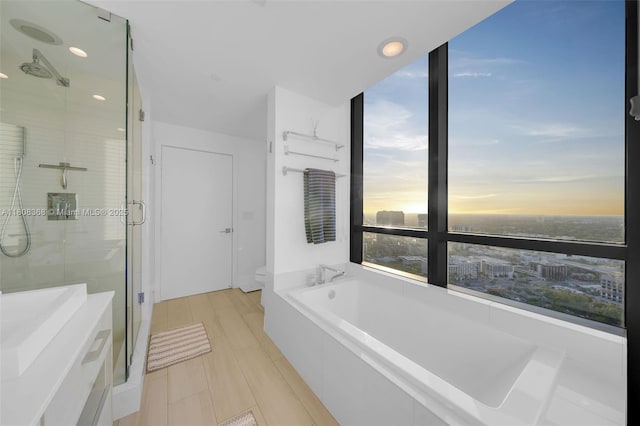650 NE 32nd St Unit 3708, Miami, FL 33137 - full bathroom with a shower stall, a bath, toilet, and recessed lighting