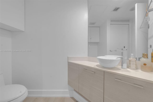 650 NE 32nd St Unit 3708, Miami, FL 33137 - bathroom with vanity, toilet, and baseboards