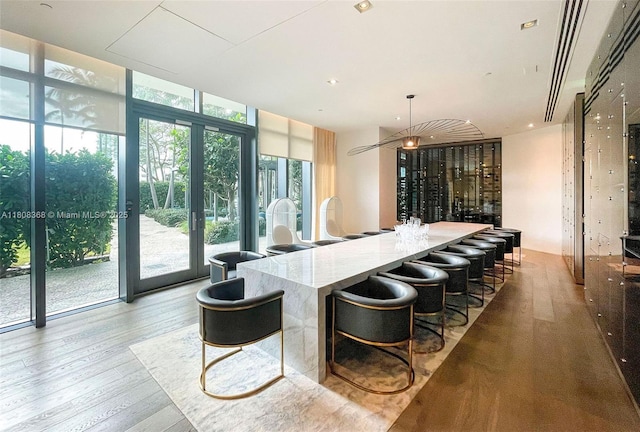 650 NE 32nd St Unit 3708, Miami, FL 33137 - bar with expansive windows and wood finished floors