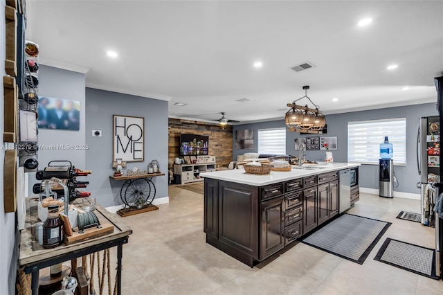 15760 SW 45th St, Miami, FL 33185 - kitchen featuring ornamental molding, light countertops, a sink, recessed lighting, and a kitchen island with sink