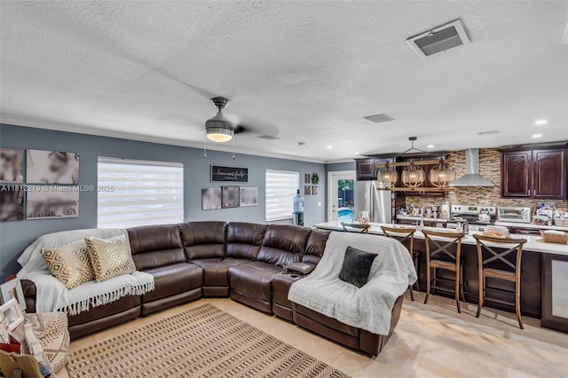 15760 SW 45th St, Miami, FL 33185 - living area featuring ornamental molding, a textured ceiling, a ceiling fan, and recessed lighting
