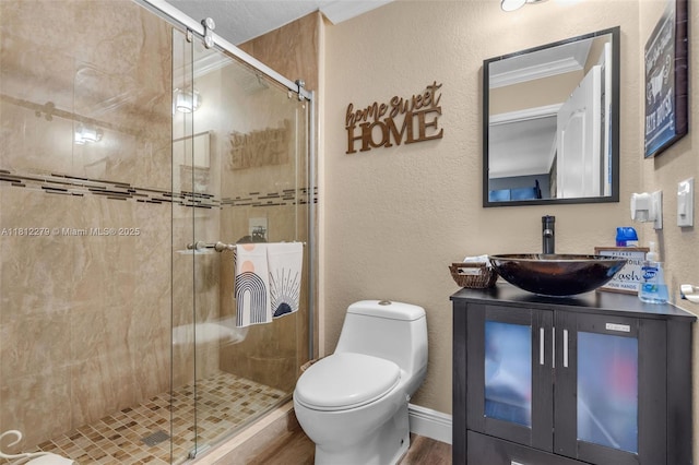15760 SW 45th St, Miami, FL 33185 - full bathroom featuring toilet, vanity, a stall shower, wood finished floors, and a textured wall
