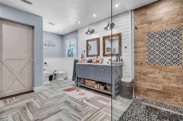 15760 SW 45th St, Miami, FL 33185 - bathroom featuring a bidet, wooden walls, double vanity, a walk in shower, and recessed lighting