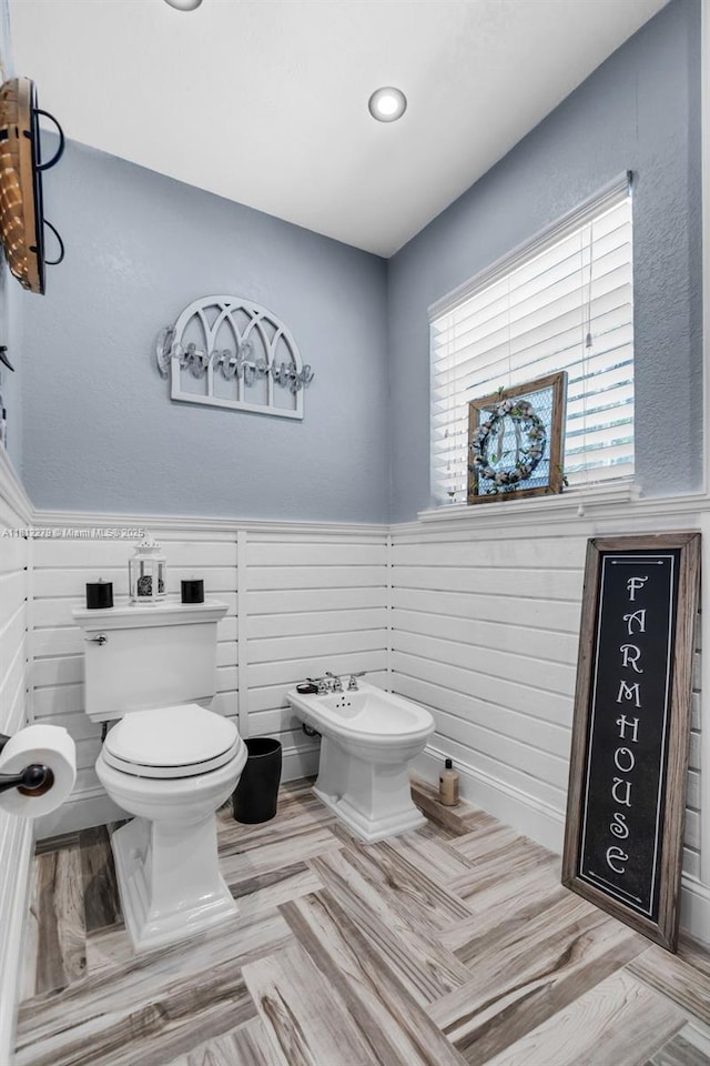 15760 SW 45th St, Miami, FL 33185 - half bathroom with toilet, wainscoting, and a bidet