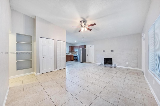 501 Carolina Ave, Fort Lauderdale, FL 33312 - unfurnished living room with a ceiling fan, built in features, a brick fireplace, and baseboards