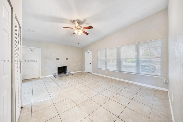 501 Carolina Ave, Fort Lauderdale, FL 33312 - unfurnished living room with vaulted ceiling, ceiling fan, a brick fireplace, light tile patterned floors, and baseboards