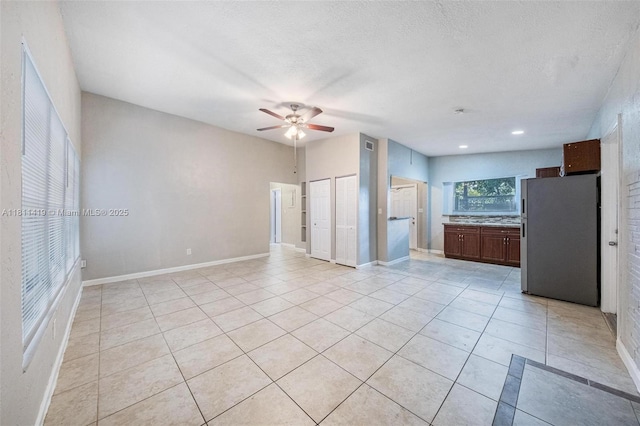 501 Carolina Ave, Fort Lauderdale, FL 33312 - unfurnished living room featuring a ceiling fan, light tile patterned flooring, and baseboards