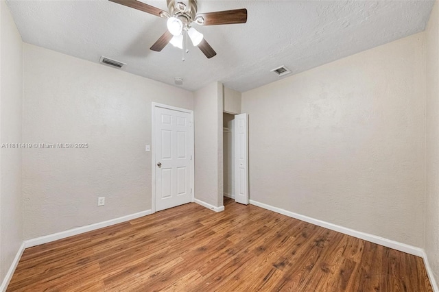 501 Carolina Ave, Fort Lauderdale, FL 33312 - unfurnished bedroom with baseboards, wood finished floors, a ceiling fan, and a closet
