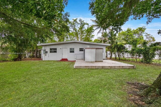 501 Carolina Ave, Fort Lauderdale, FL 33312 - back of house with a yard and stucco siding
