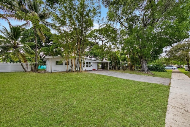 501 Carolina Ave, Fort Lauderdale, FL 33312 - view of front of house with driveway and a carport