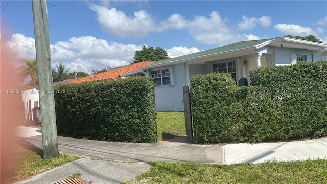 3351 SW 28th St, Miami, FL 33133 - view of side of home with stucco siding