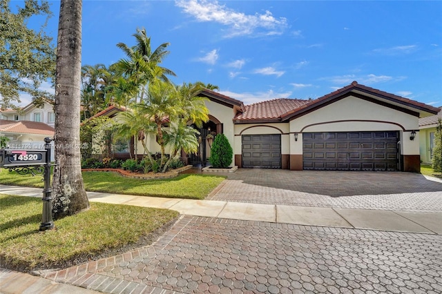 14520 SW 37th St, Miramar, FL 33027 - view of front of property with stucco siding, decorative driveway, a garage, a tile roof, and a front yard