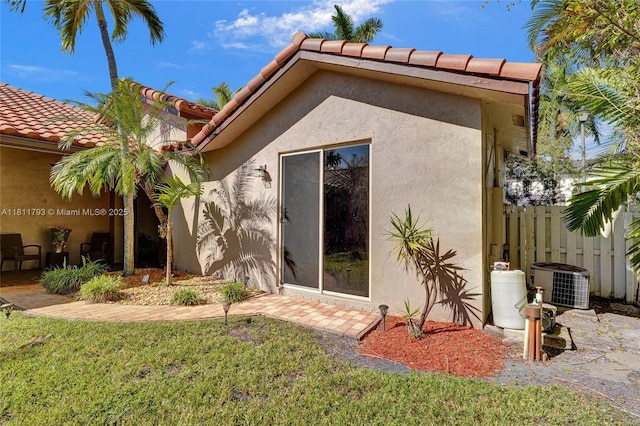 14520 SW 37th St, Miramar, FL 33027 - rear view of house with cooling unit, stucco siding, and a tile roof