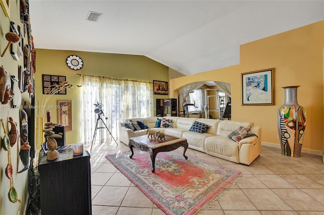 14520 SW 37th St, Miramar, FL 33027 - living area featuring arched walkways, light tile patterned floors, lofted ceiling, and baseboards