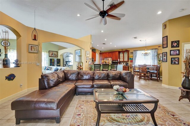 14520 SW 37th St, Miramar, FL 33027 - living room featuring arched walkways, light tile patterned flooring, a ceiling fan, recessed lighting, and a chandelier