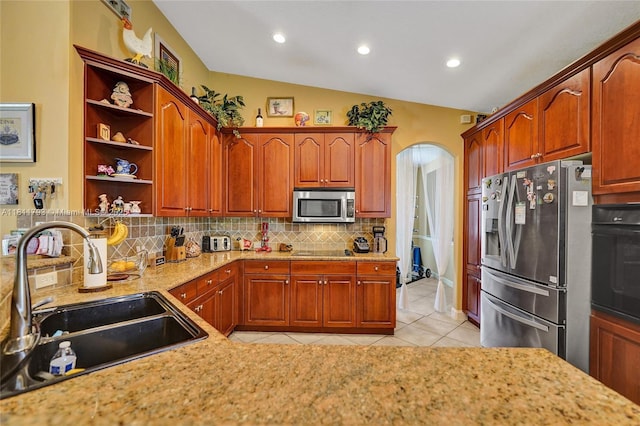 14520 SW 37th St, Miramar, FL 33027 - kitchen with black appliances, a sink, arched walkways, open shelves, and decorative backsplash
