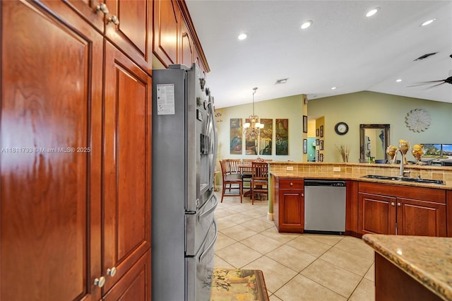 14520 SW 37th St, Miramar, FL 33027 - kitchen with appliances with stainless steel finishes, a sink, a chandelier, decorative light fixtures, and light tile patterned floors