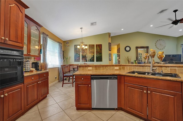 14520 SW 37th St, Miramar, FL 33027 - kitchen featuring stainless steel dishwasher, black oven, a sink, vaulted ceiling, and decorative light fixtures