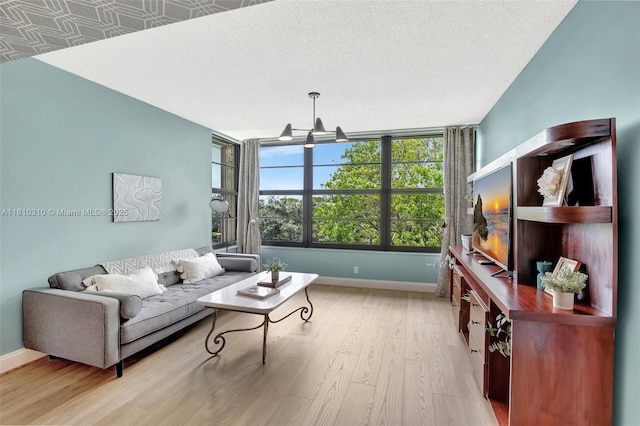 1709 Whitehall Dr Unit 401, Davie, FL 33324 - living room featuring light wood-style flooring and baseboards