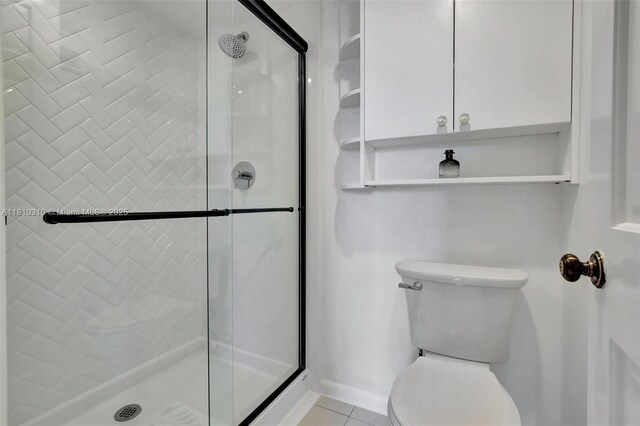 1709 Whitehall Dr Unit 401, Davie, FL 33324 - full bath featuring a shower stall, toilet, and tile patterned flooring