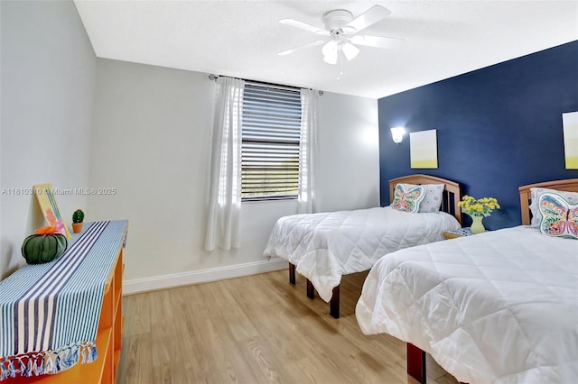 1709 Whitehall Dr Unit 401, Davie, FL 33324 - bedroom with baseboards, light wood finished floors, and ceiling fan