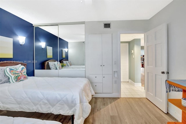 1709 Whitehall Dr Unit 401, Davie, FL 33324 - bedroom featuring light wood-style flooring