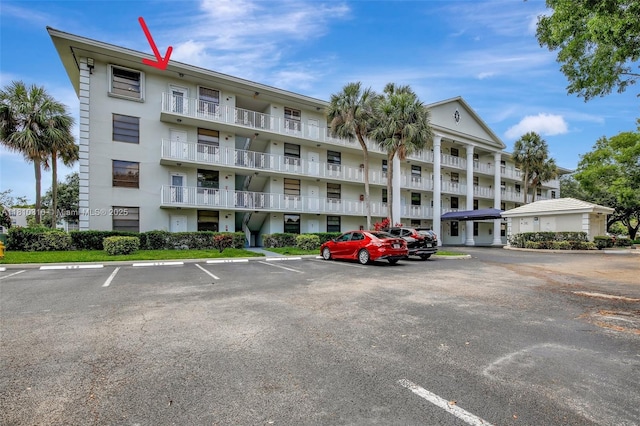 1709 Whitehall Dr Unit 401, Davie, FL 33324 - view of apartment building / complex featuring uncovered parking