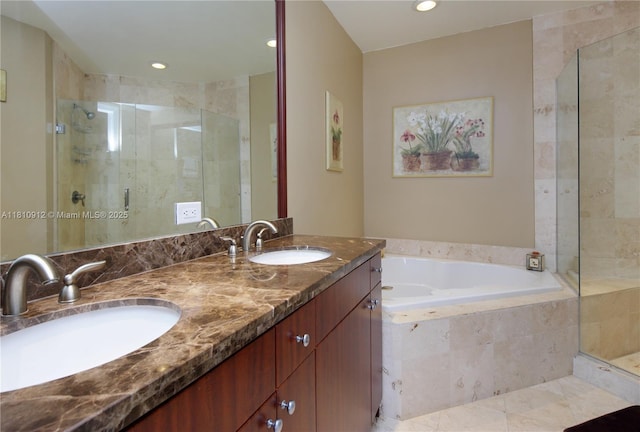 1607 Ponce De Leon Blvd Unit 12E, Coral Gables, FL 33134 - bathroom featuring a shower stall, a garden tub, double vanity, recessed lighting, and tile patterned flooring
