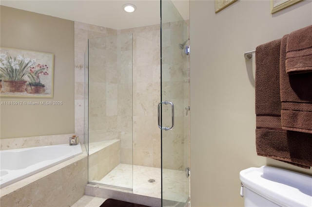 1607 Ponce De Leon Blvd Unit 12E, Coral Gables, FL 33134 - bathroom with a garden tub, a shower stall, toilet, and recessed lighting