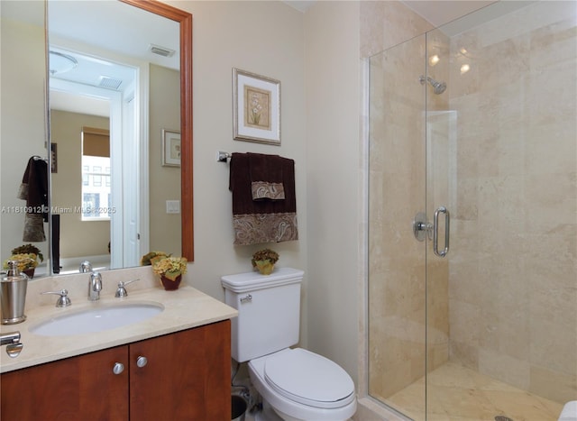 1607 Ponce De Leon Blvd Unit 12E, Coral Gables, FL 33134 - bathroom with a shower stall, vanity, and toilet
