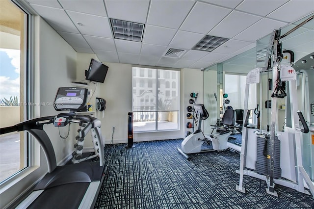 1607 Ponce De Leon Blvd Unit 12E, Coral Gables, FL 33134 - workout area featuring a paneled ceiling and baseboards
