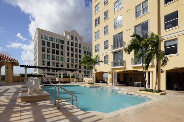 1607 Ponce De Leon Blvd Unit 12E, Coral Gables, FL 33134 - community pool featuring a patio