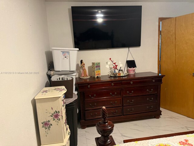 3297 W 70th St, Hialeah, FL 33018 - bedroom with light marble finish flooring