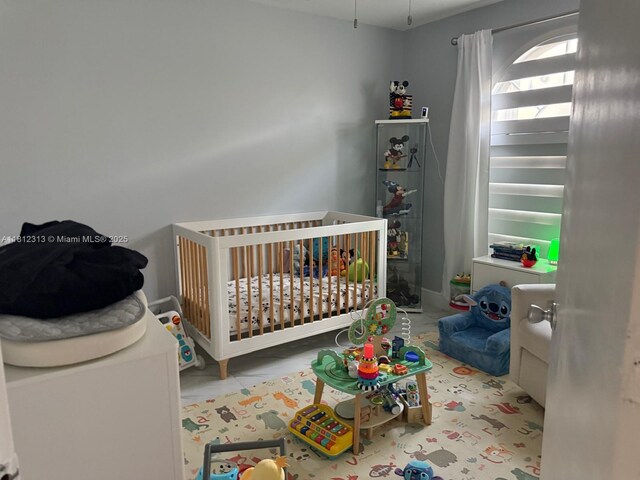3297 W 70th St, Hialeah, FL 33018 - bedroom with a crib
