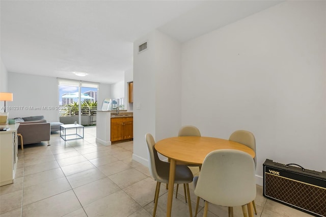 1723 SW 2nd Ave Unit 502, Miami, FL 33129 - dining space featuring light tile patterned flooring and baseboards