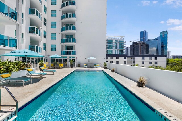 1723 SW 2nd Ave Unit 502, Miami, FL 33129 - community pool featuring a patio area