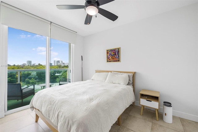1723 SW 2nd Ave Unit 502, Miami, FL 33129 - bedroom with multiple windows, access to exterior, a view of city, and light tile patterned floors