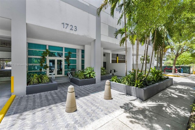 1723 SW 2nd Ave Unit 502, Miami, FL 33129 - view of exterior entry with french doors and stucco siding