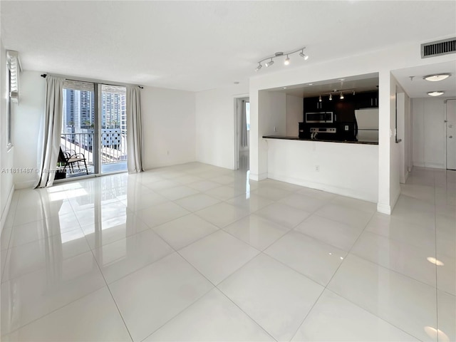 850 N Miami Ave Unit W-1903, Miami, FL 33136 - unfurnished living room featuring light tile patterned flooring and floor to ceiling windows