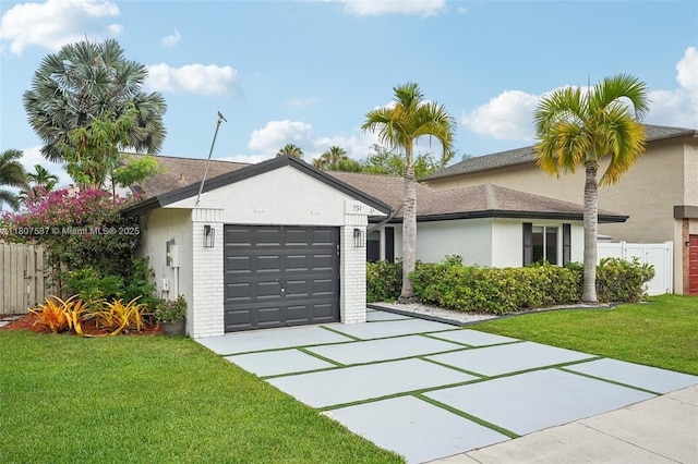 731 Briarwood Ter, Davie, FL 33325 - view of front of property with concrete driveway, a garage, stucco siding, and brick siding